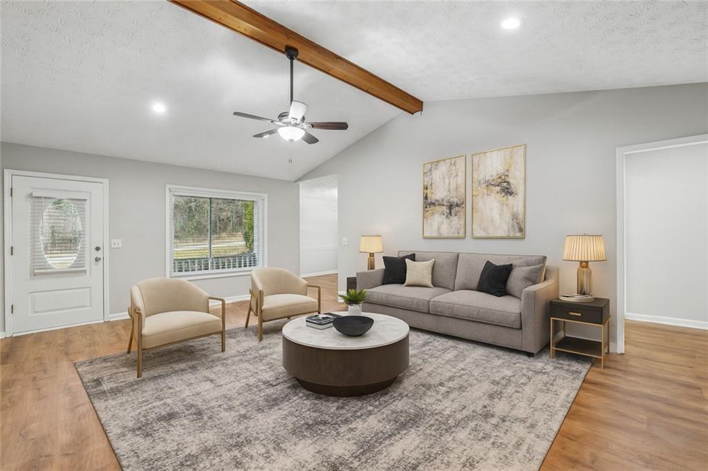 1076 Blackwell Road Marietta, GA 30066 - Photo 6 of 34 a living room with furniture and a chandelier