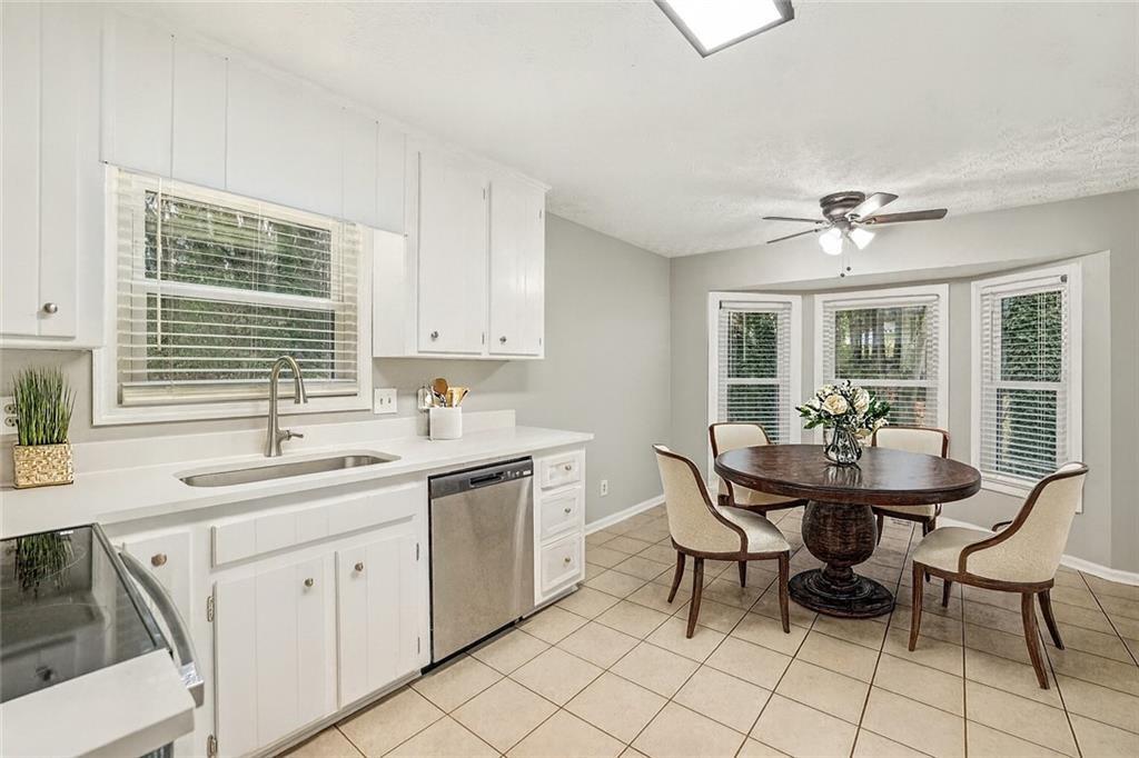1076 Blackwell Road Marietta, GA 30066 - Photo 10 of 34 a kitchen with a sink cabinets and window