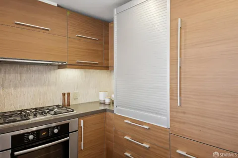 a kitchen with a stove and a microwave