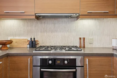 a kitchen with a stove and a sink