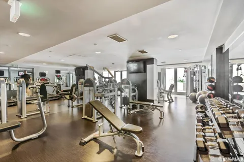 a view of a chairs and table in the backyard