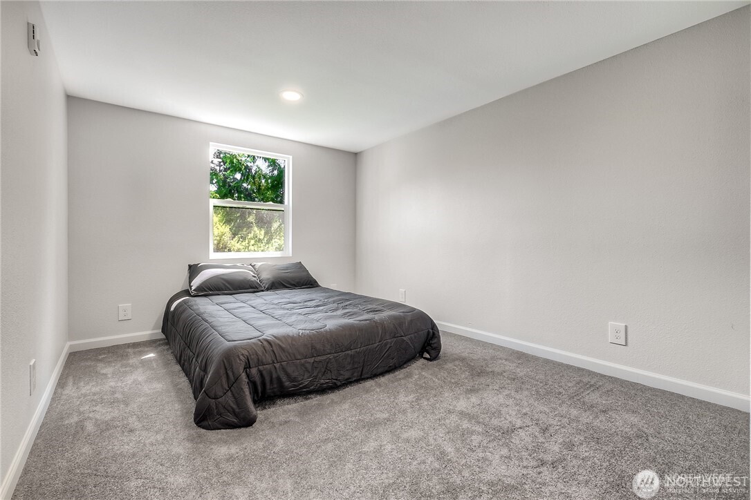 32407 72nd Avenue South Roy, WA 98580 - Photo 14 of 24 a bedroom with a bed and a window