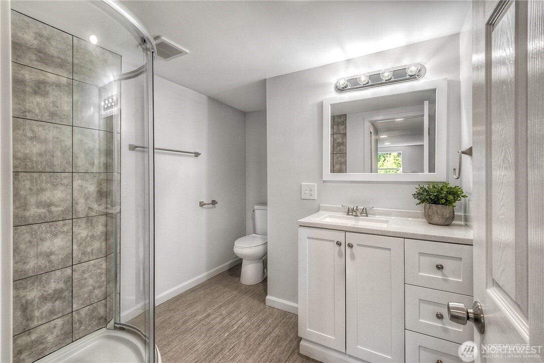 32407 72nd Avenue South Roy, WA 98580 - Photo 15 of 24 a bathroom with a granite countertop sink a mirror and a shower