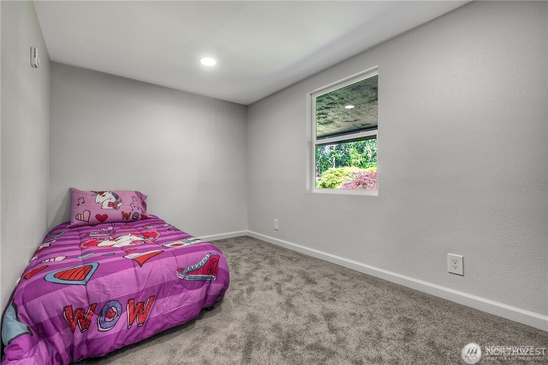 32407 72nd Avenue South Roy, WA 98580 - Photo 17 of 24 a bedroom with a bed and a window