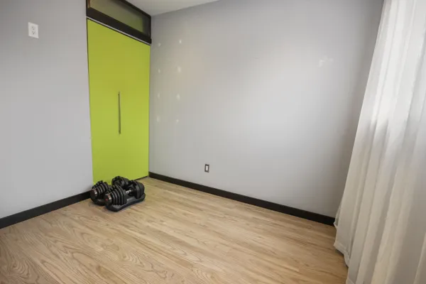 a room with a closet and a window