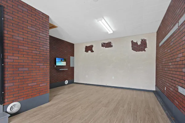 a view of a livingroom with wooden floor