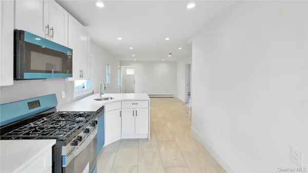 a kitchen with a stove and a microwave