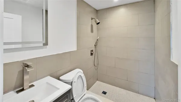 a bathroom with a sink and a shower