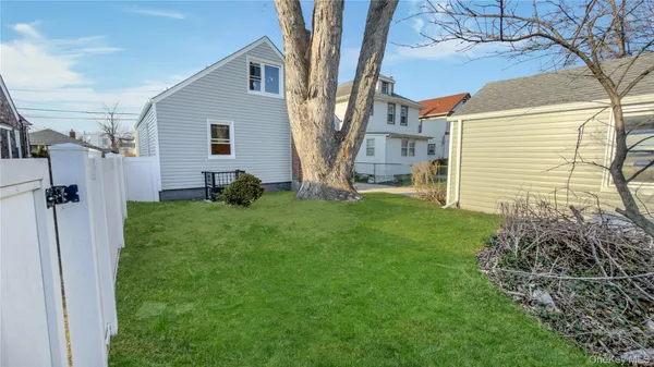 a view of backyard with a small cabin