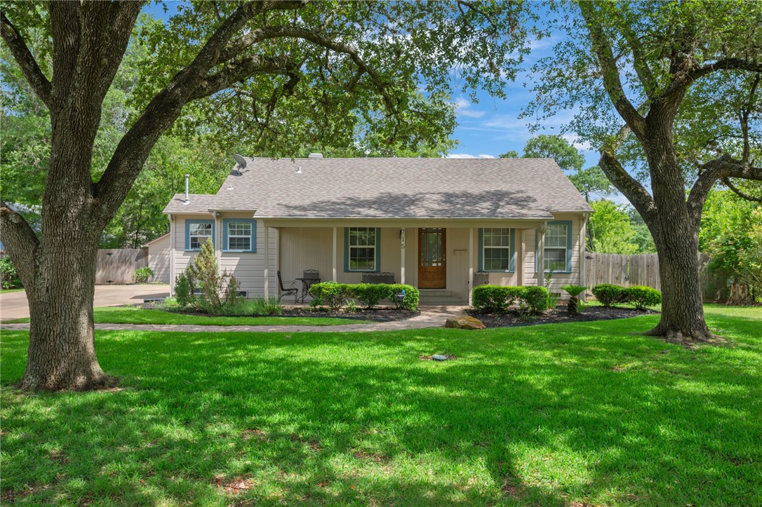 715 Inwood Drive Bryan, TX 77802 - Photo 1 of 34 a front view of a house with a yard deck and a garden