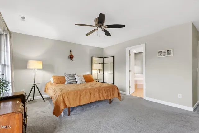 a bathroom with a tub sink shower and mirror