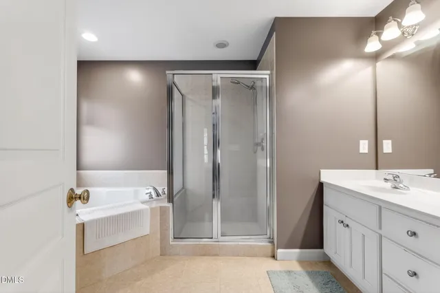 a bathroom with a tub and shower