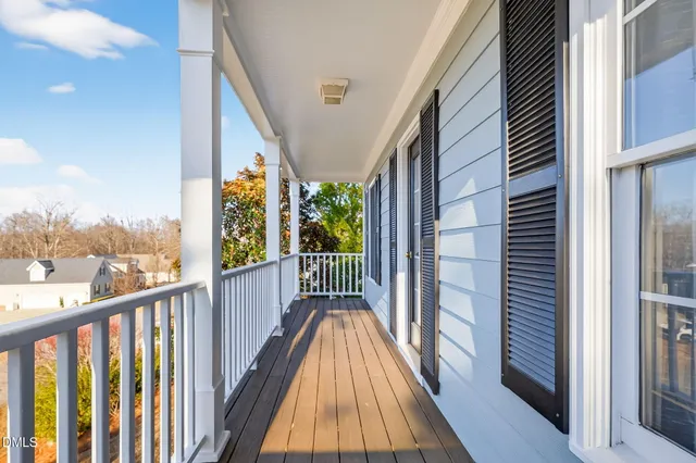 a view of balcony with wooden floor