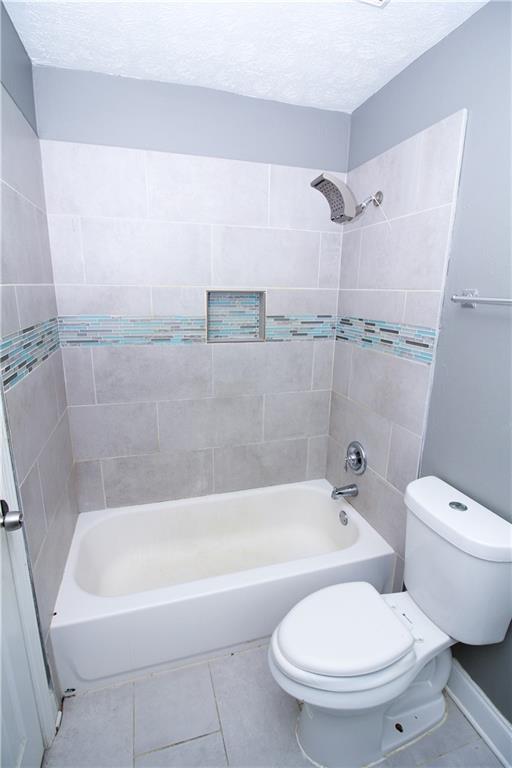 2340 Beaver Ruin Road, Unit UN7 Norcross, GA 30071 - Photo 14 of 20 a white bath tub sitting next to a white toilet