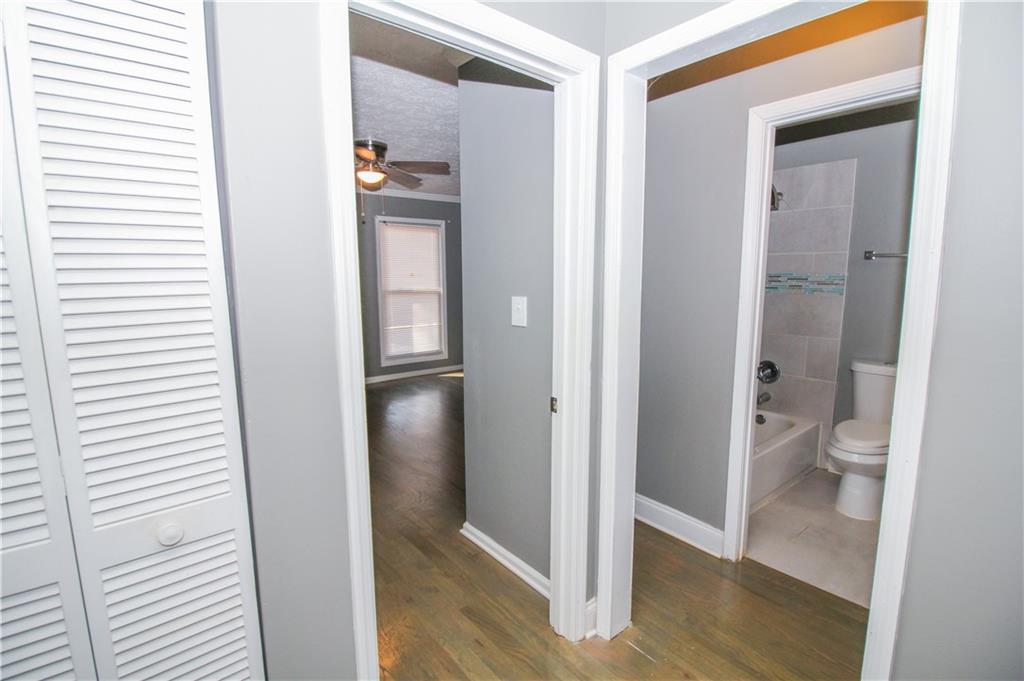 2340 Beaver Ruin Road, Unit UN7 Norcross, GA 30071 - Photo 17 of 20 a bathroom with a granite countertop toilet and shower
