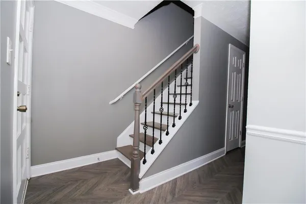 a view of entryway with wooden floor