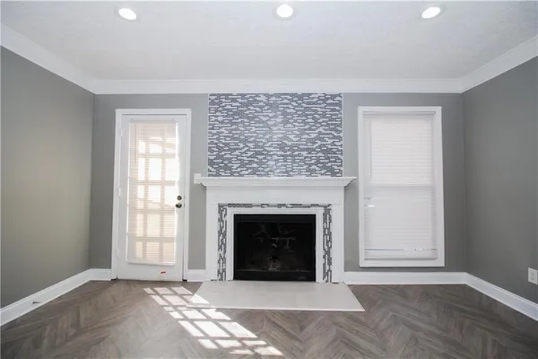 a living room with a fireplace and a table