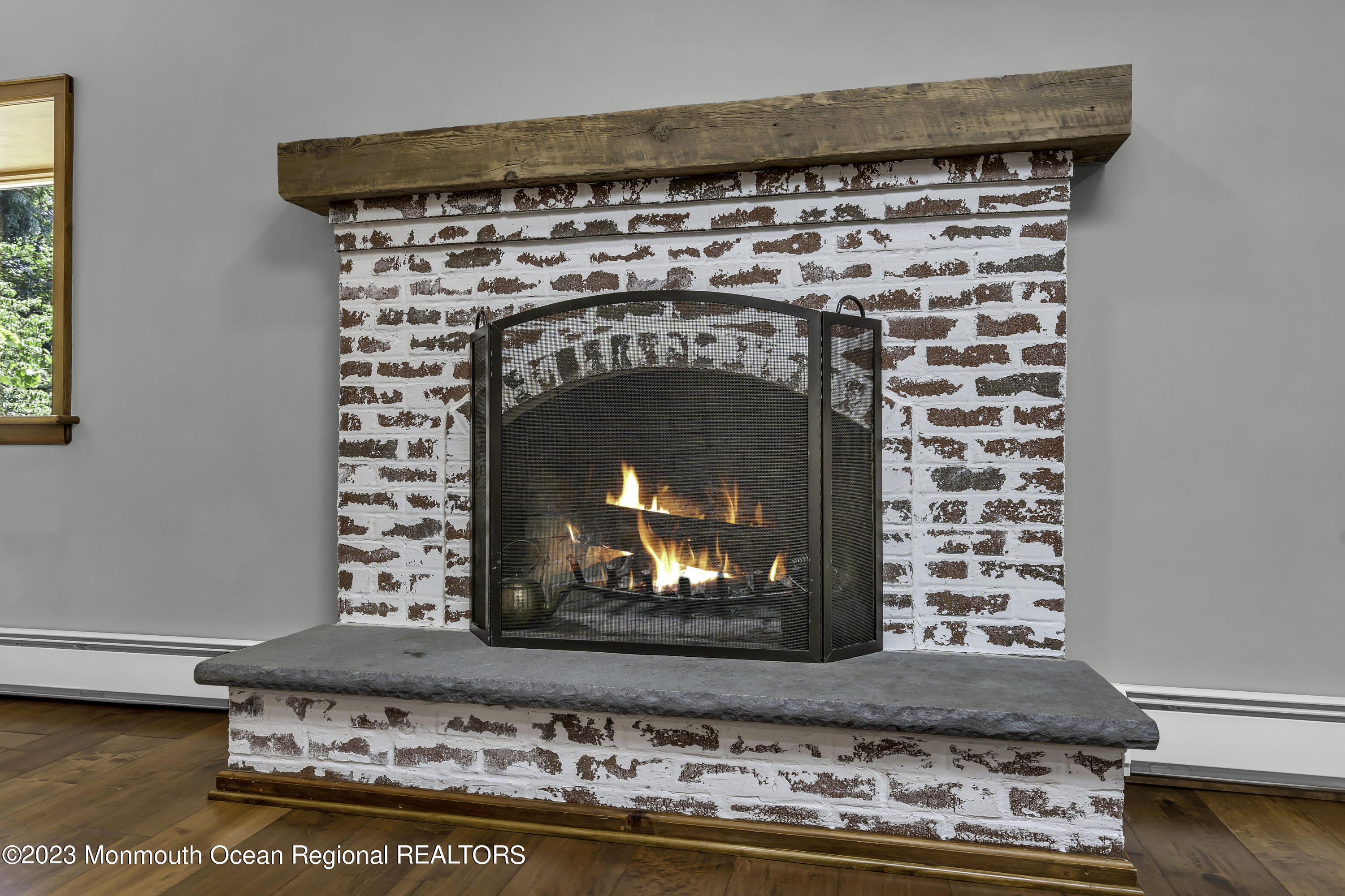 3 Allen Terrace New Egypt, NJ 08533 - Photo 12 of 97 a fireplace with a clock on top of it