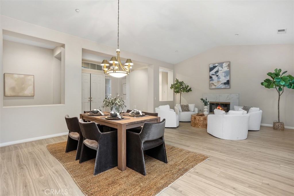 608 Inverlochy Drive Fallbrook, CA 92028 - Photo 11 of 52 a living room with a table chairs and a table