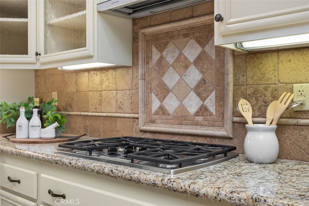 608 Inverlochy Drive Fallbrook, CA 92028 - Photo 17 of 52 a kitchen with a granite countertop sink and cabinets