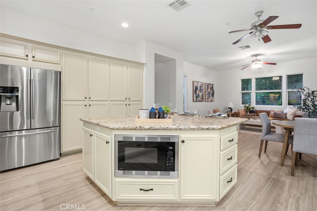 608 Inverlochy Drive Fallbrook, CA 92028 - Photo 19 of 52 a kitchen with a stove and a refrigerator