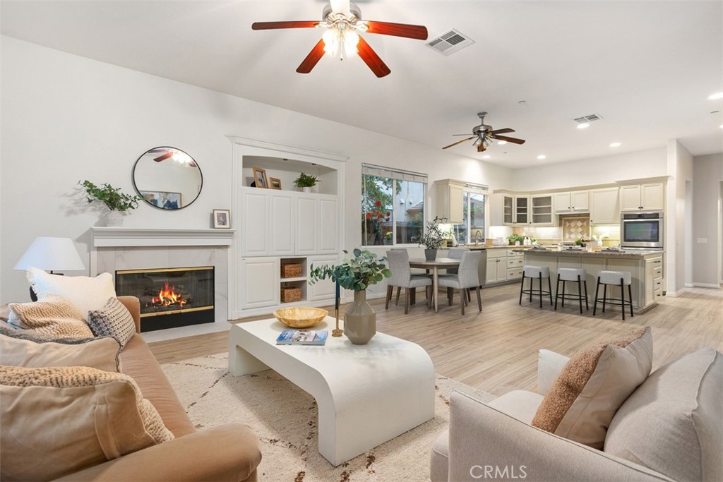 608 Inverlochy Drive Fallbrook, CA 92028 - Photo 21 of 52 a living room with furniture and a fireplace