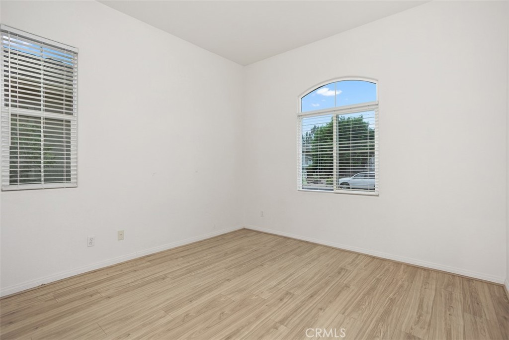 608 Inverlochy Drive Fallbrook, CA 92028 - Photo 33 of 52 an empty room with wooden floor and windows