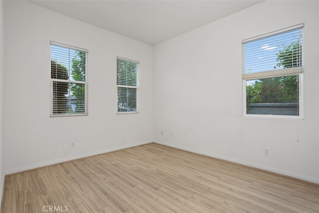 608 Inverlochy Drive Fallbrook, CA 92028 - Photo 34 of 52 a view of empty room with wooden floor and fan
