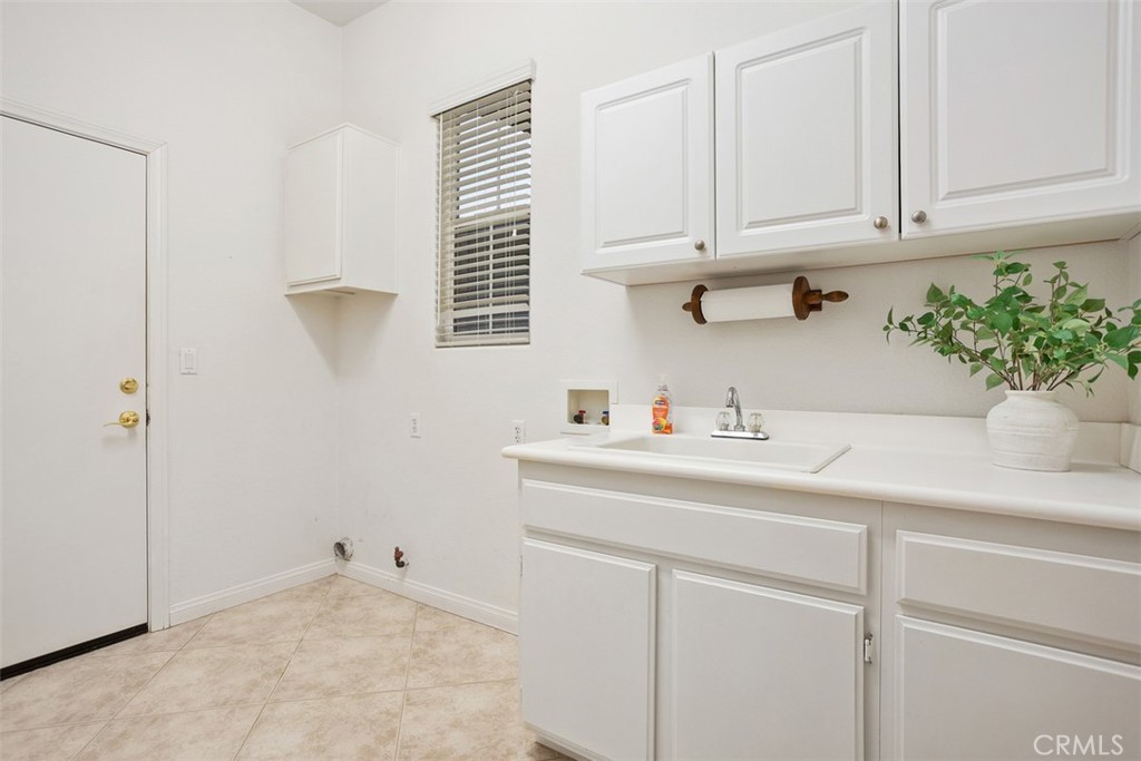 608 Inverlochy Drive Fallbrook, CA 92028 - Photo 37 of 52 a kitchen with a sink and cabinets