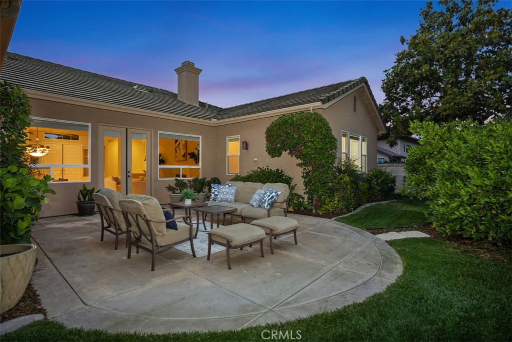 608 Inverlochy Drive Fallbrook, CA 92028 - Photo 4 of 52 a view of a patio with couches table and chairs and potted plants