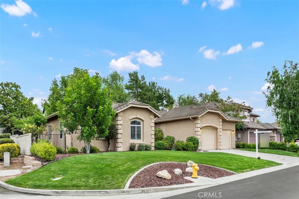 608 Inverlochy Drive Fallbrook, CA 92028 - Photo 46 of 52 a front view of a house with a yard and garage