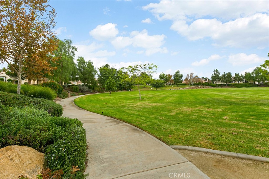 608 Inverlochy Drive Fallbrook, CA 92028 - Photo 48 of 52 a view of a golf course with a garden