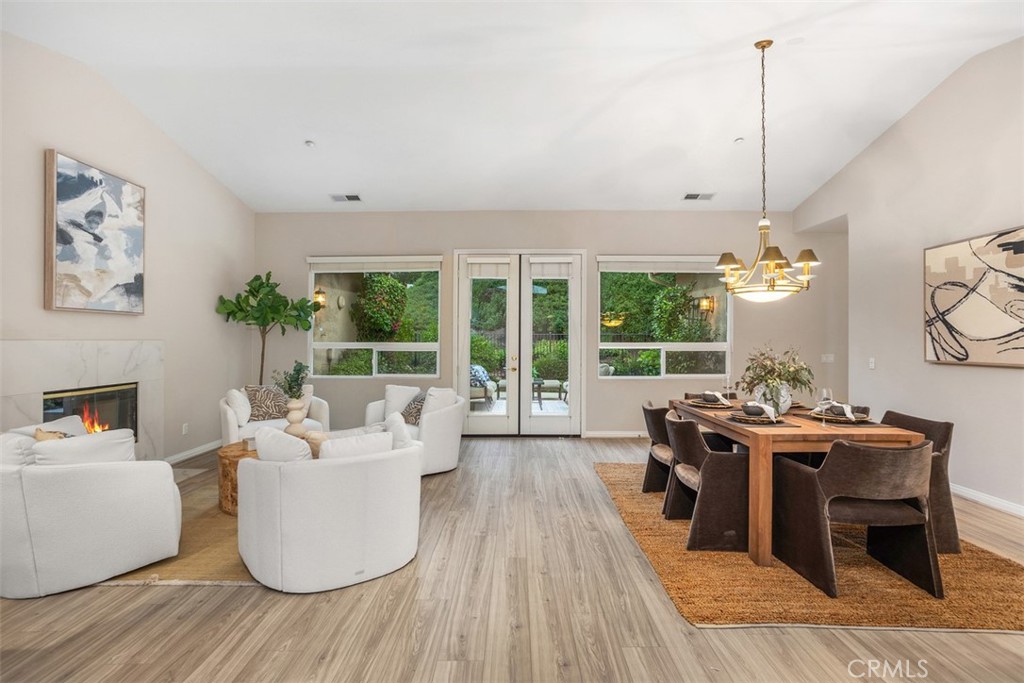 608 Inverlochy Drive Fallbrook, CA 92028 - Photo 8 of 52 a living room with fireplace furniture and a large window