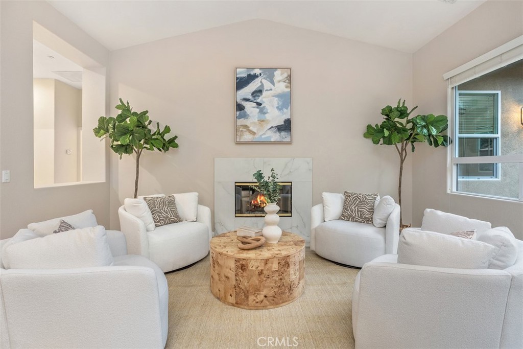 608 Inverlochy Drive Fallbrook, CA 92028 - Photo 10 of 52 a living room with furniture plant and a window