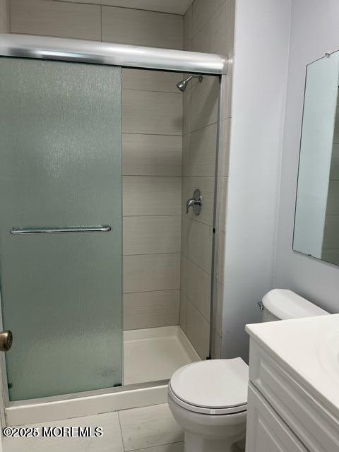 222 Medford Court, Unit E Manalapan, NJ 07726 - Photo 6 of 9 a white toilet sitting next to a bathroom