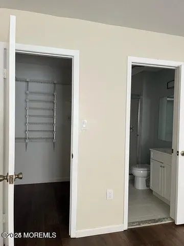 a view of a bathroom from a hallway