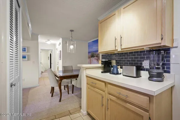 a kitchen with a sink cabinets and window