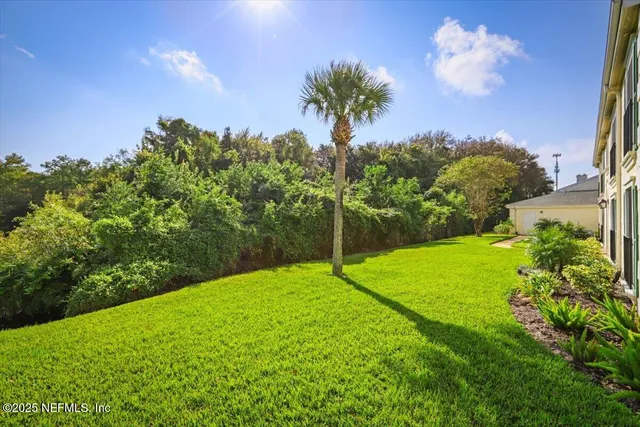 a backyard of a house with lots of green space