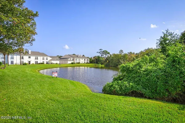 a view of a lake with a yard