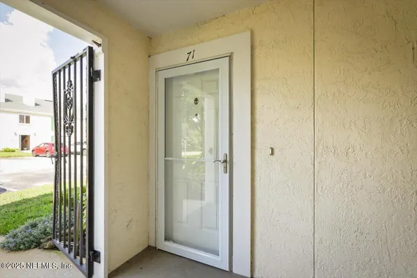 a view of a bathroom with a glass door