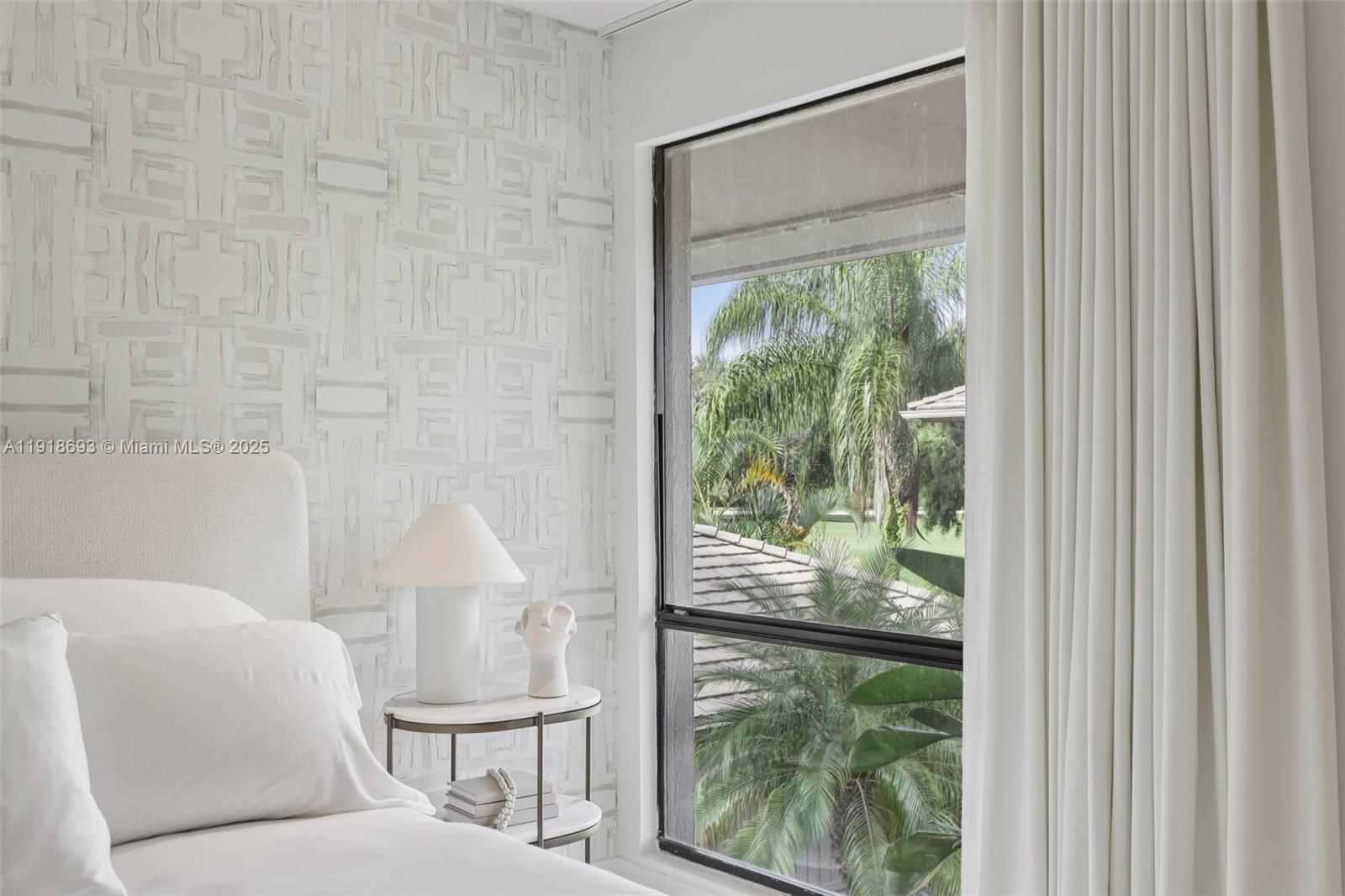 7123 Rain Forest Drive, Unit A Boca Raton, FL 33434 - Photo 29 of 75 a living room with a large window and a table