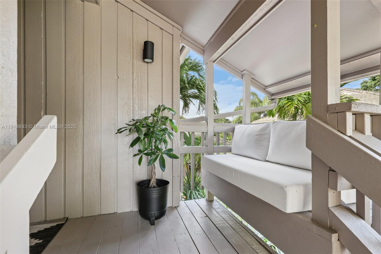 7123 Rain Forest Drive, Unit A Boca Raton, FL 33434 - Photo 3 of 75 a living room with furniture and a potted plant