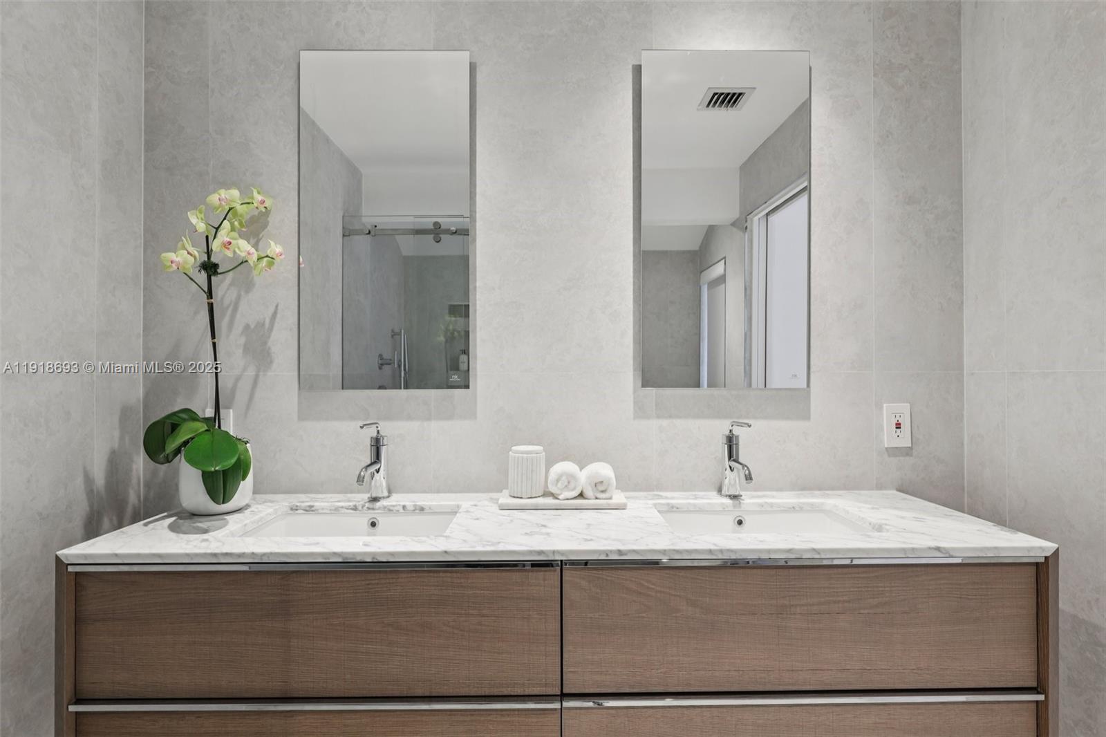 7123 Rain Forest Drive, Unit A Boca Raton, FL 33434 - Photo 33 of 75 a bathroom with a sink and a mirror