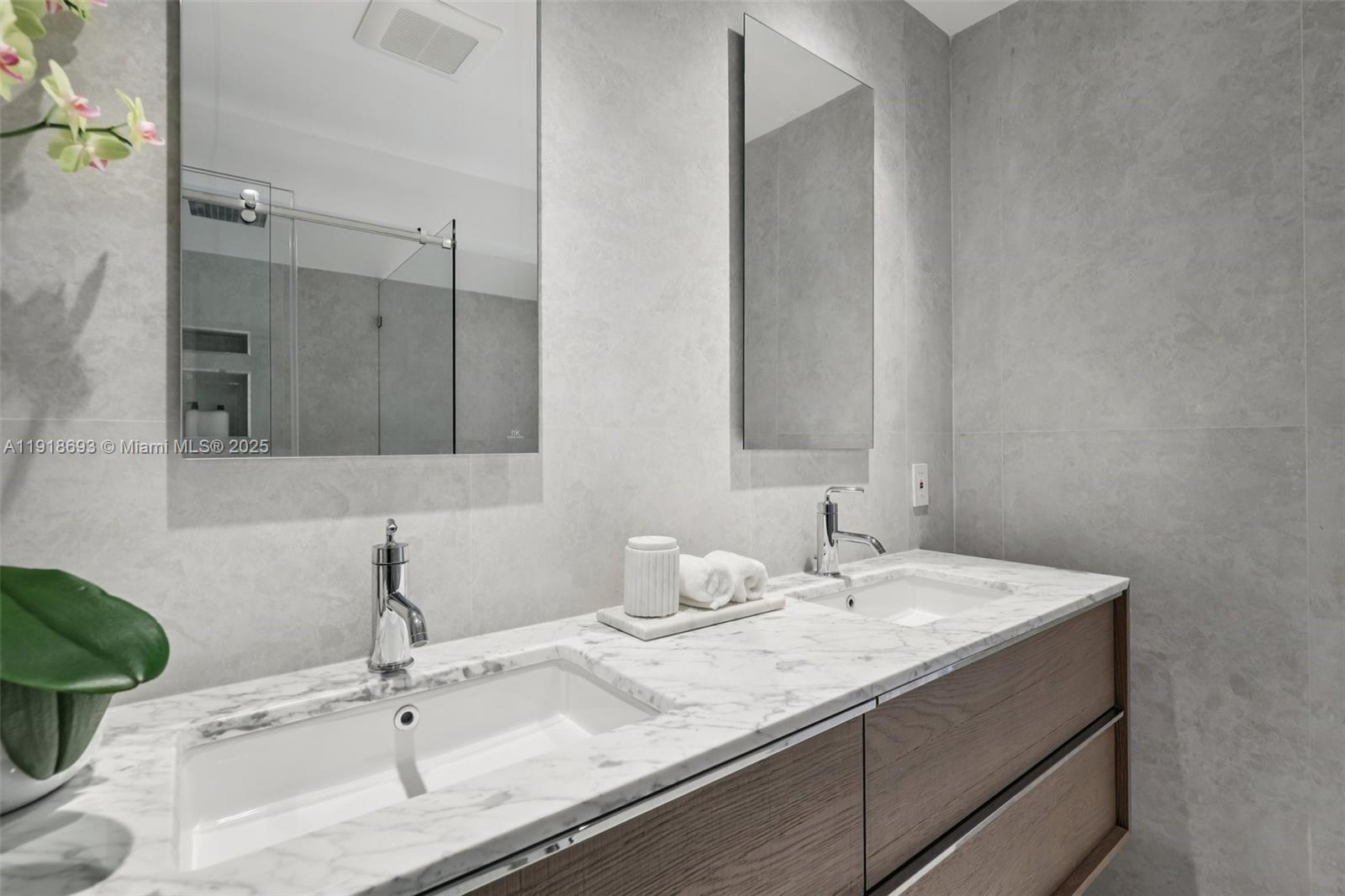 7123 Rain Forest Drive, Unit A Boca Raton, FL 33434 - Photo 34 of 75 a bathroom with a sink and a mirror