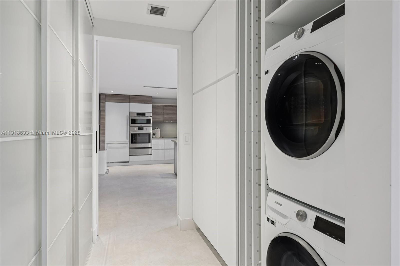 7123 Rain Forest Drive, Unit A Boca Raton, FL 33434 - Photo 38 of 75 a view of a hallway with washer and dryer