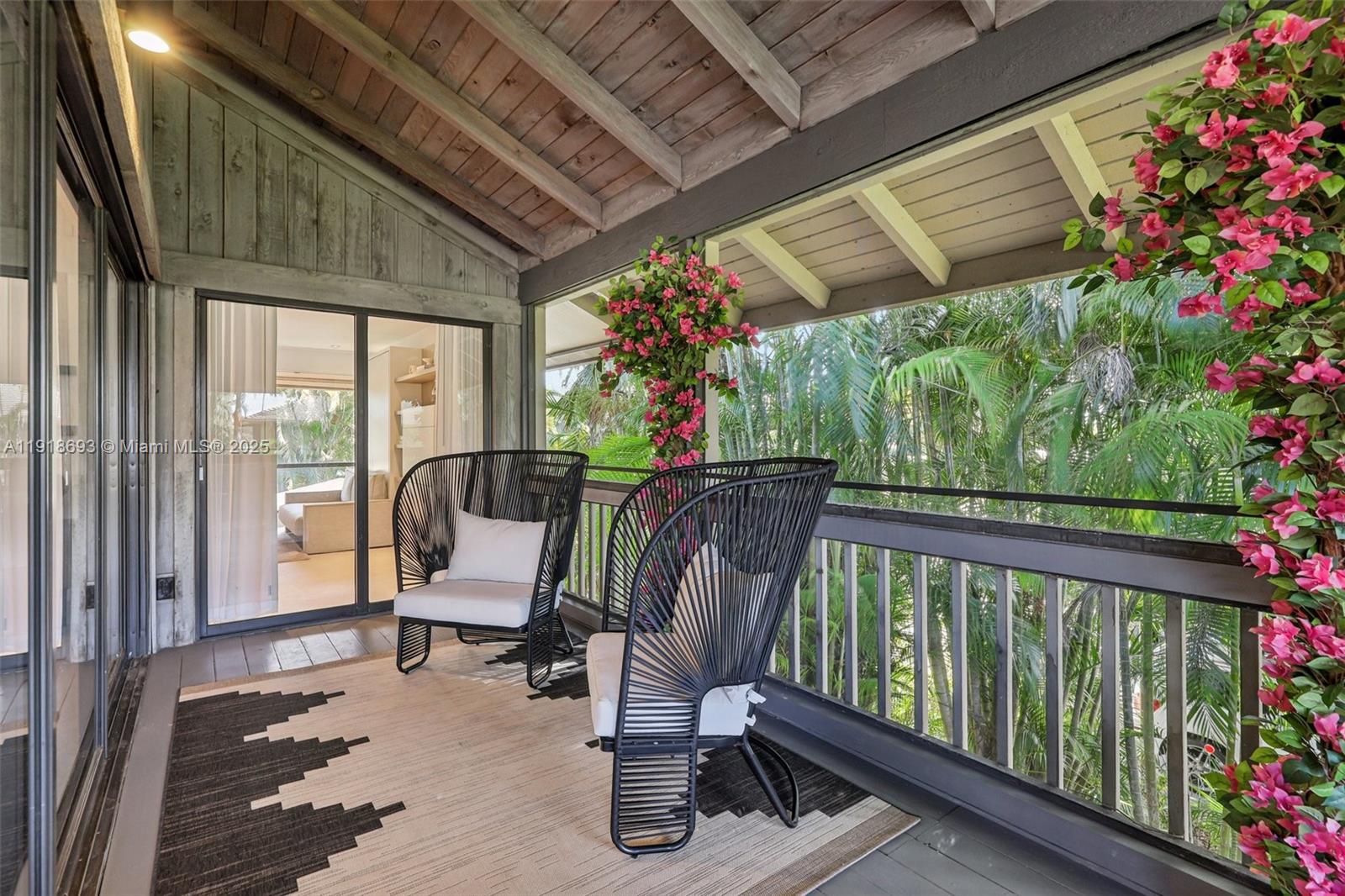 7123 Rain Forest Drive, Unit A Boca Raton, FL 33434 - Photo 53 of 75 a view of a porch with furniture and garden