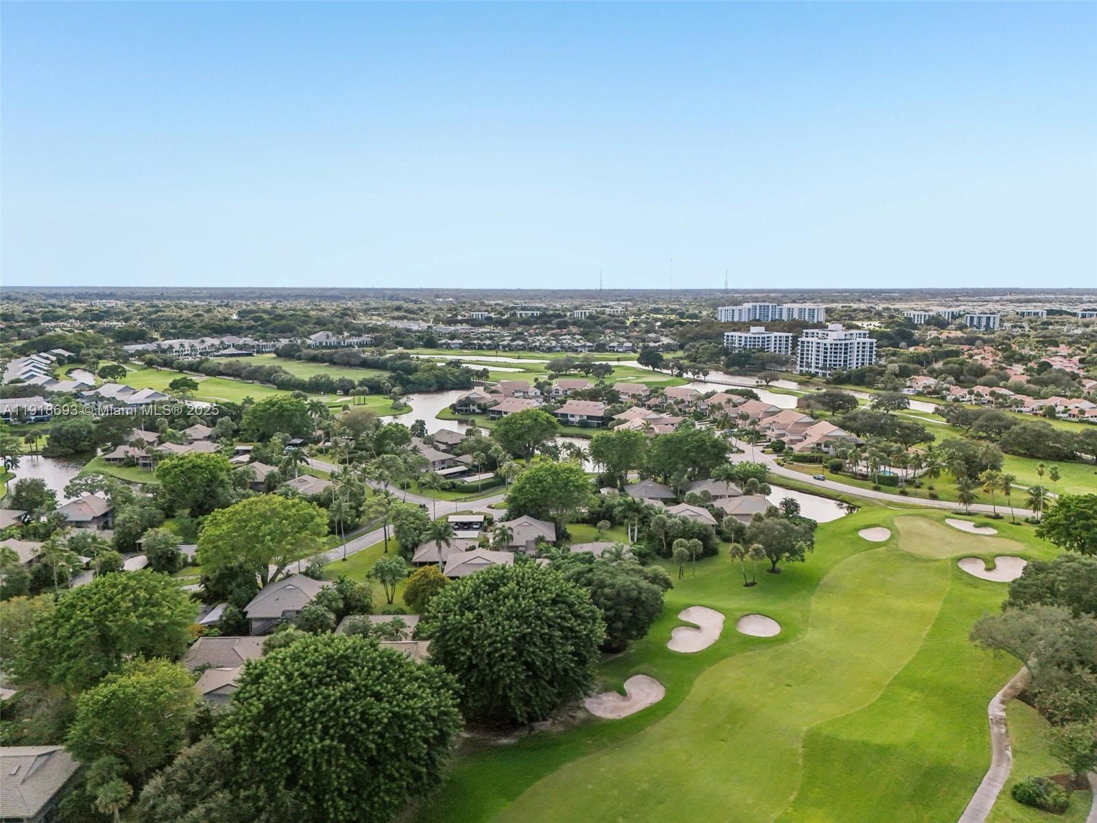 7123 Rain Forest Drive, Unit A Boca Raton, FL 33434 - Photo 73 of 75 an aerial view of a houses with a yard