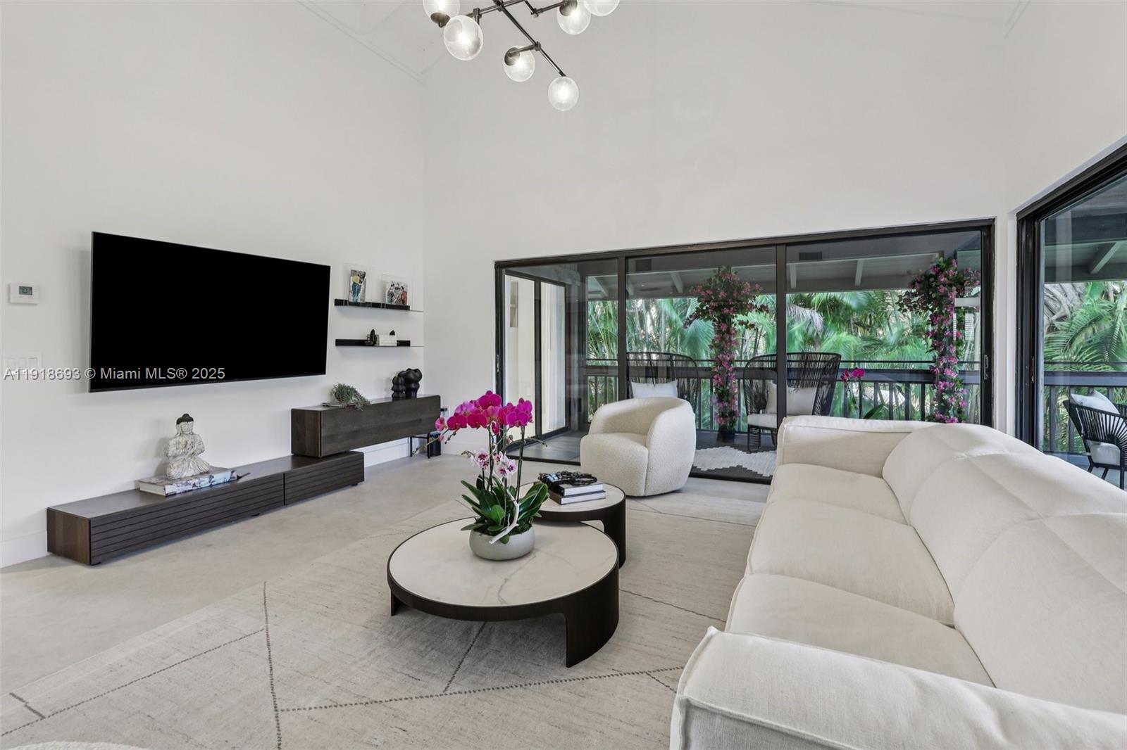 7123 Rain Forest Drive, Unit A Boca Raton, FL 33434 - Photo 8 of 75 a living room with furniture and a flat screen tv