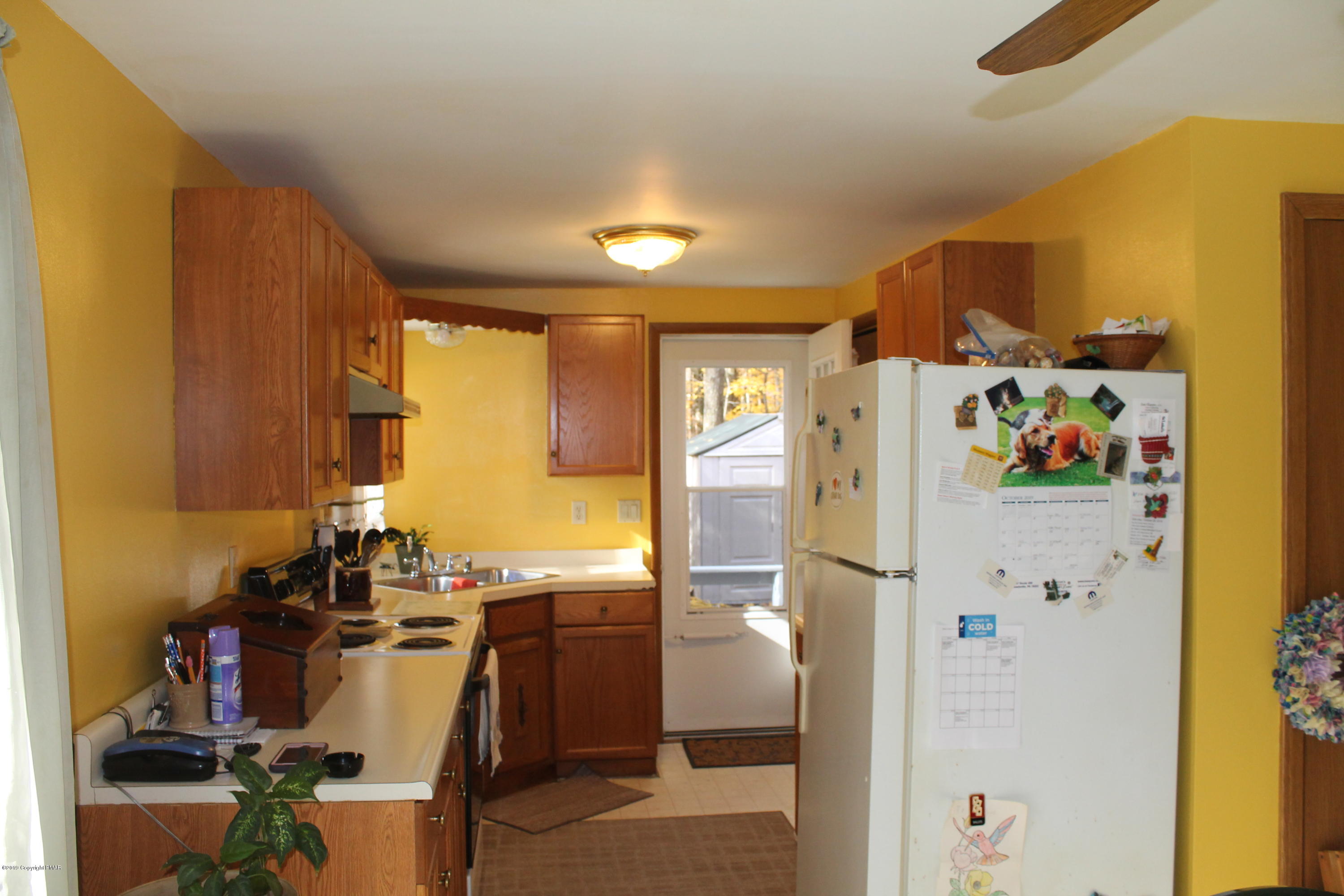 1110 Silver Maple Road West Effort, PA 18330 - Photo 4 of 6 a kitchen with a refrigerator and microwave