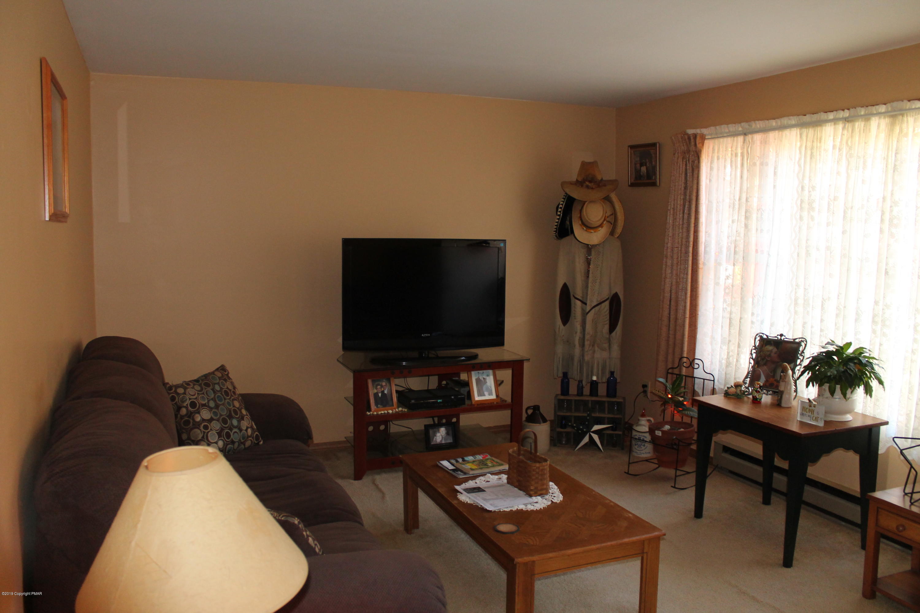 1110 Silver Maple Road West Effort, PA 18330 - Photo 5 of 6 a living room with furniture and a flat screen tv